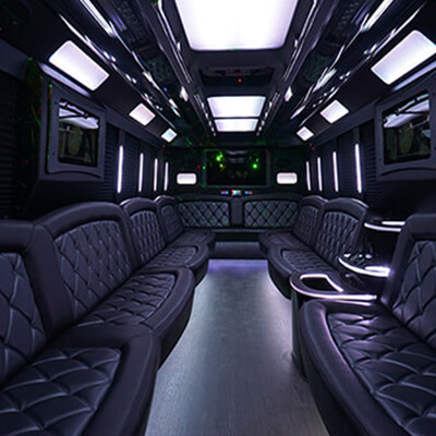 spacious party bus with several tvs