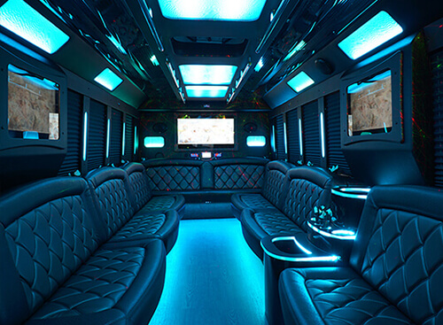 several flat screen tvs inside bus